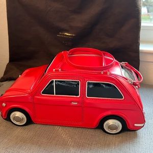 Kate spade beautiful limited edition never used leather red convertible bug car.